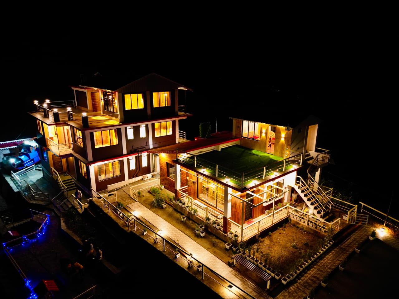 Aerial view of property at night